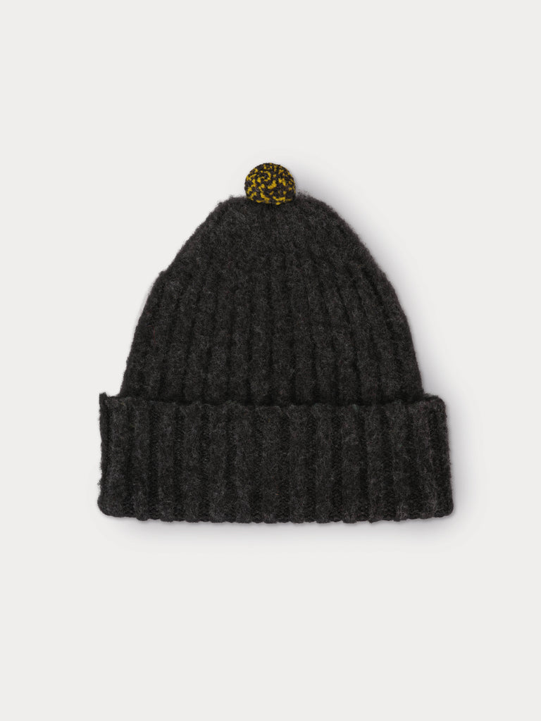 grey beanie with yellow and black speckled pompom